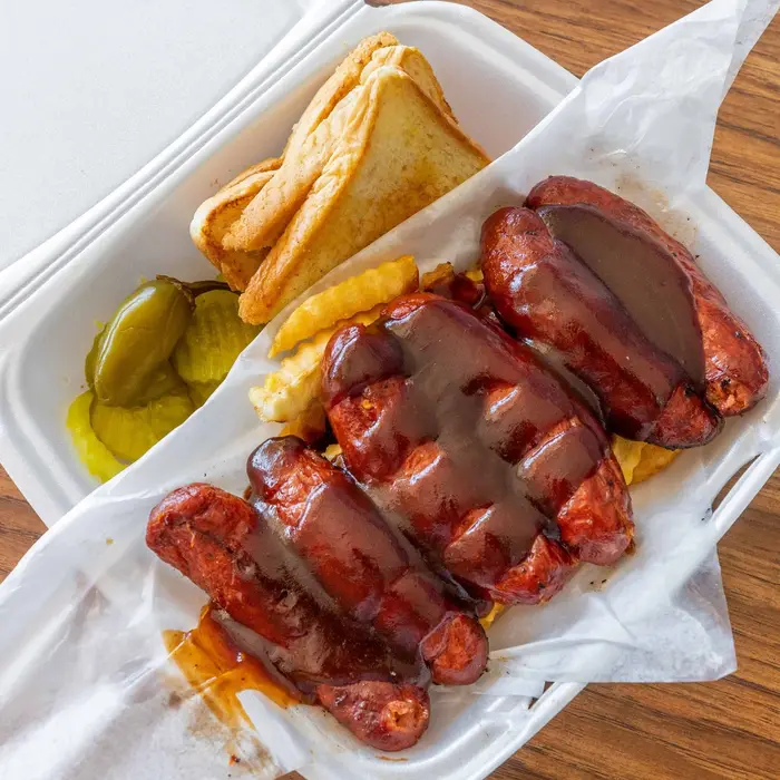 Sausage links with fries and toast