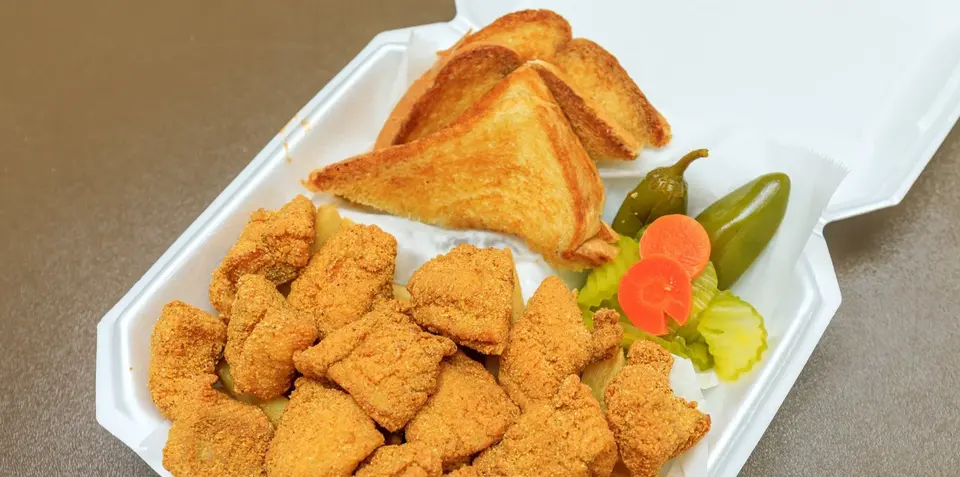 Fried catfish nuggets with fries and toast