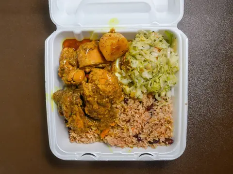 Oliver's Kitchen curry chicken plate with rice and cabbage